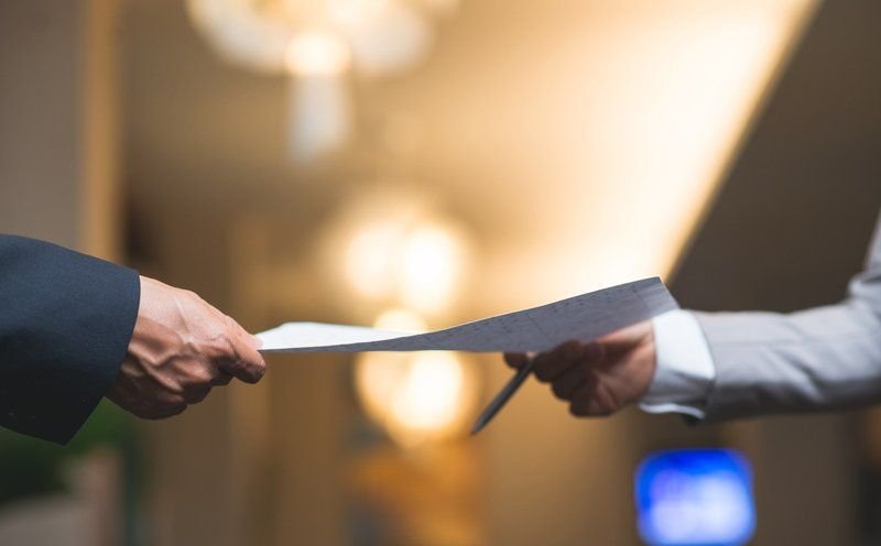 Solicitor handing over immigration documents