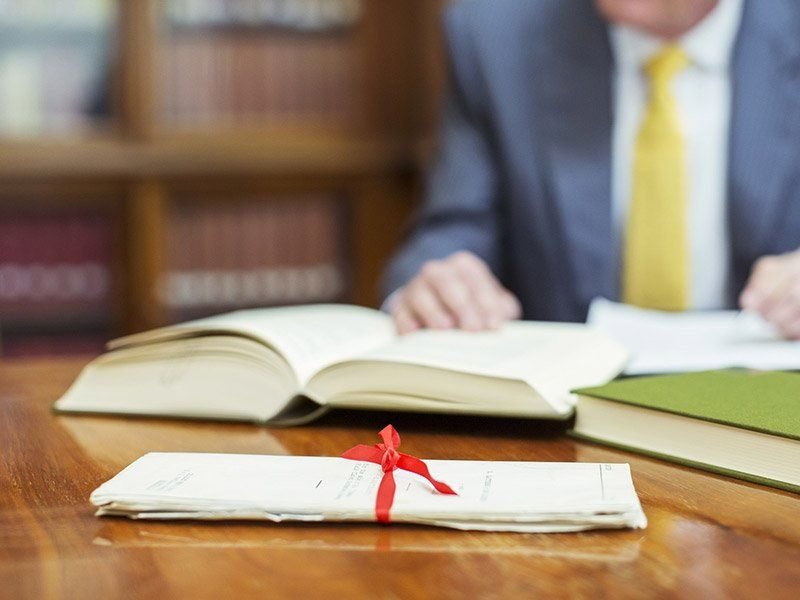 Legal case papers tied with ribbon